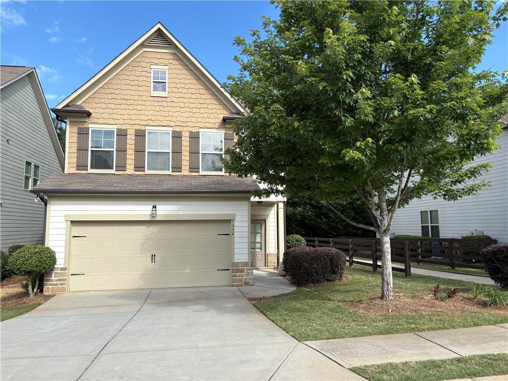 5934 Watersdown Way Flowery Branch, GA 30542 - Photo 1 of 28 a front view of a house with garage