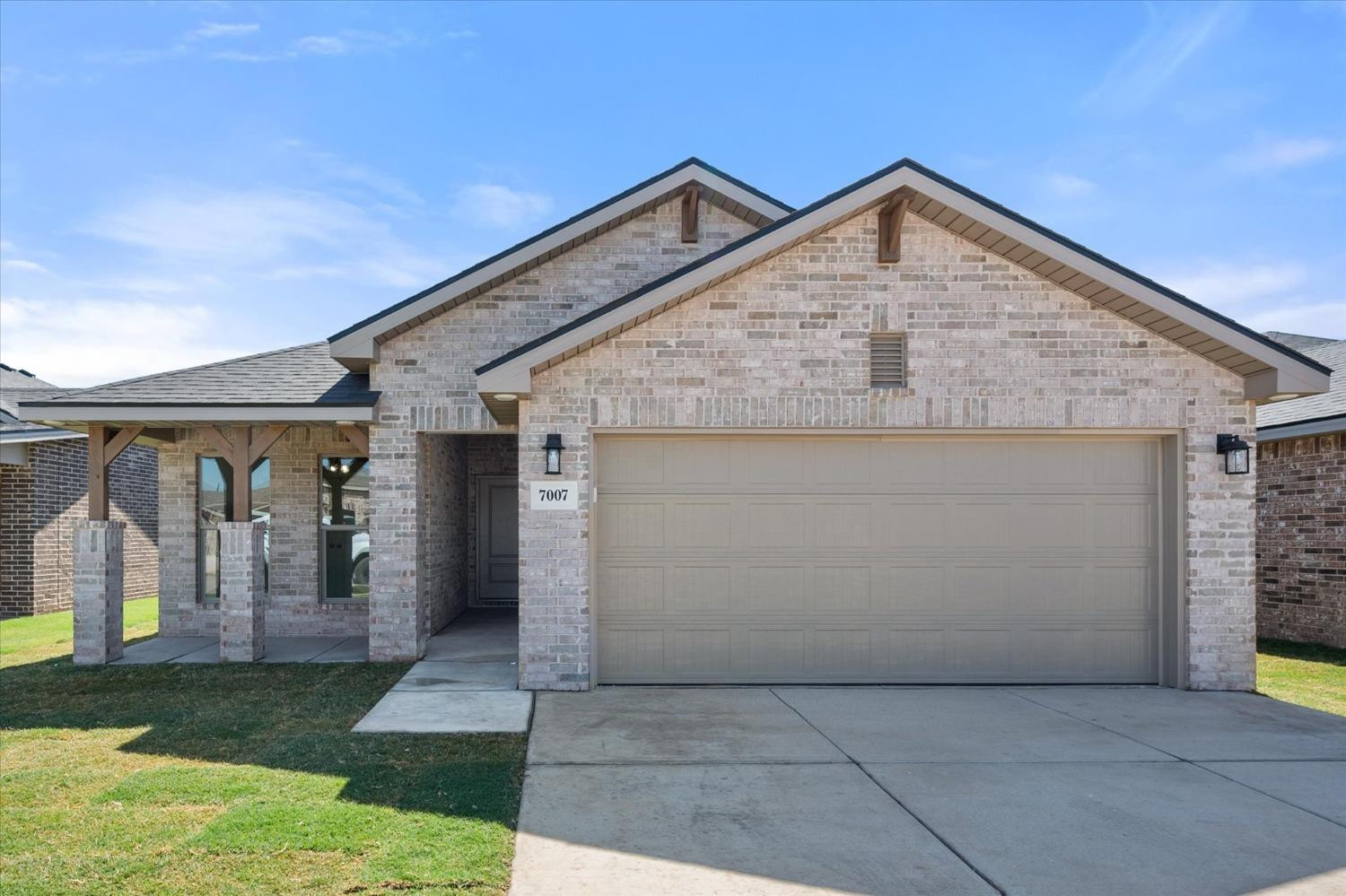 7007 9th Street Lubbock, TX 79416 - Photo 1 of 22 a front view of a house with a yard