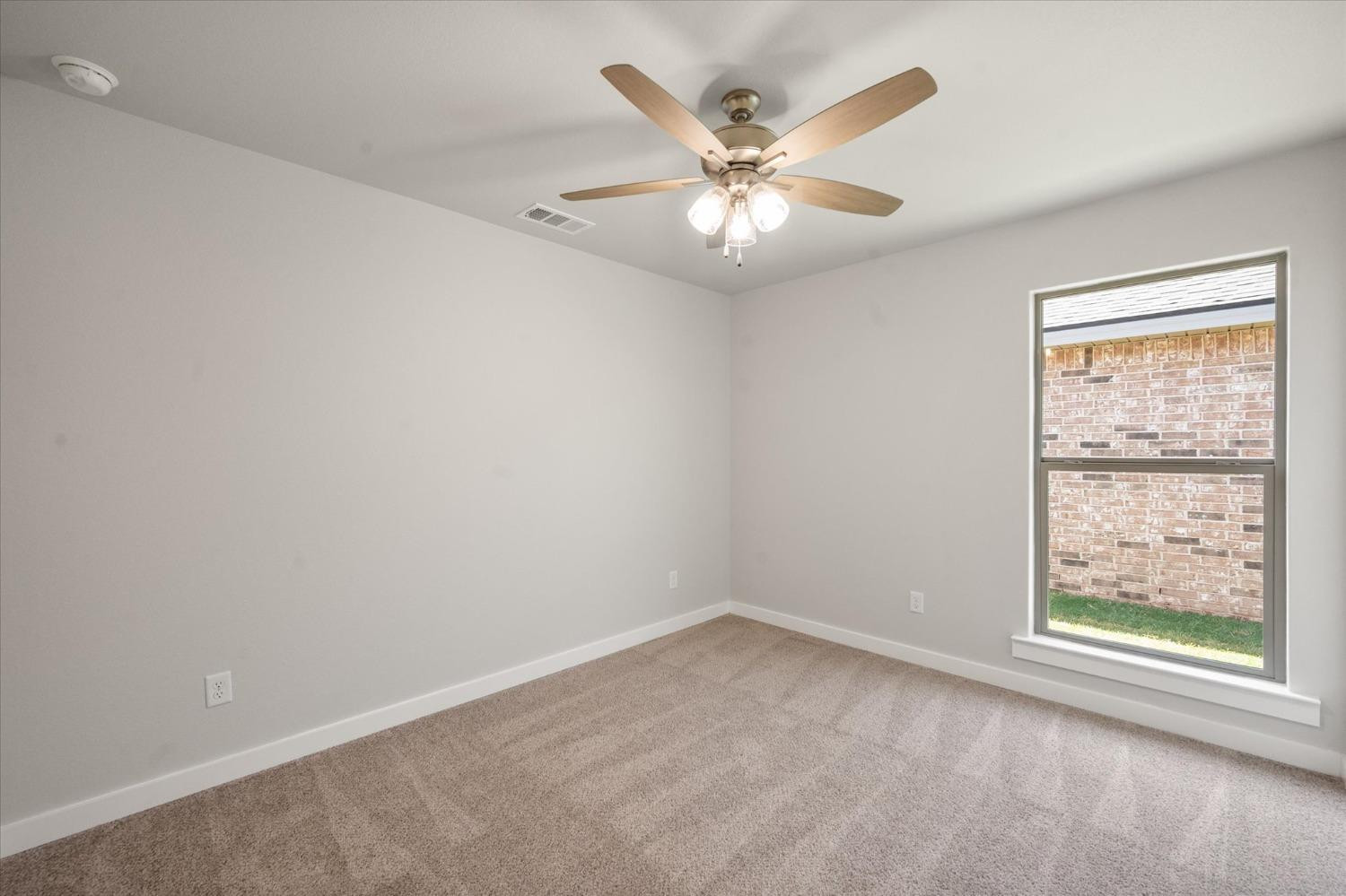 7007 9th Street Lubbock, TX 79416 - Photo 18 of 22 an empty room with a window