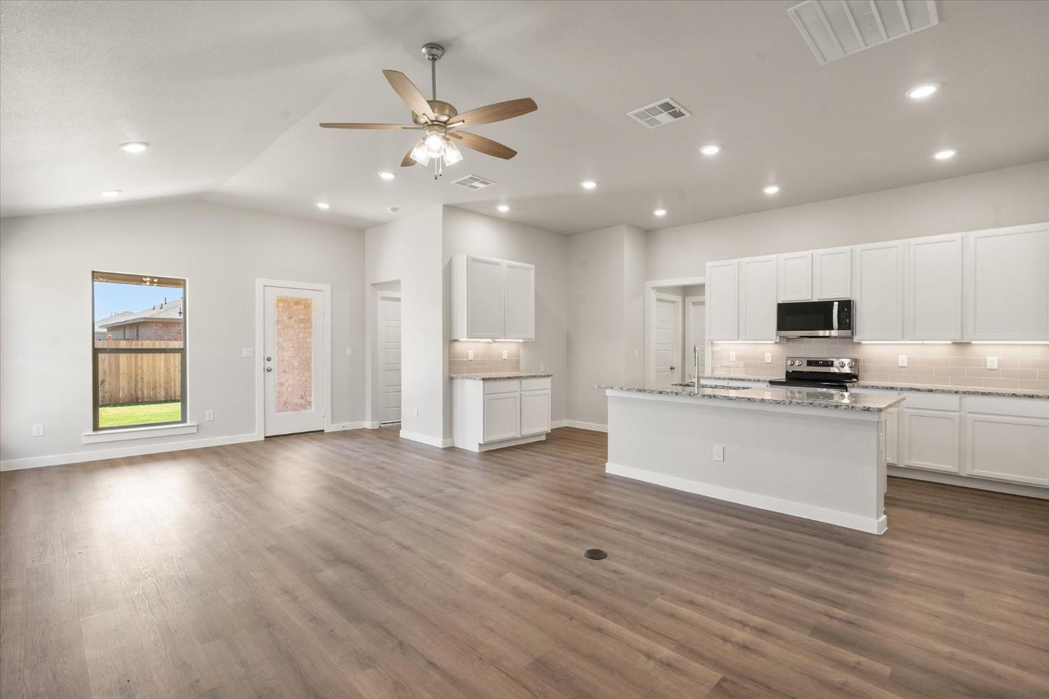 7007 9th Street Lubbock, TX 79416 - Photo 4 of 22 a view of kitchen with closet and wooden floor