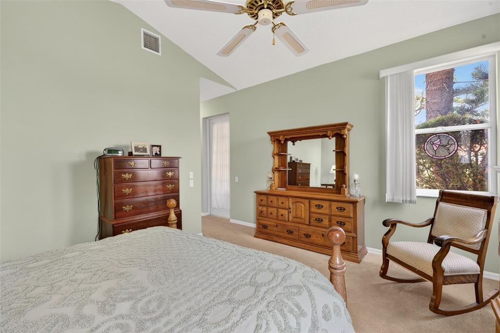 4266 Summertree Road Venice, FL 34293 - Photo 21 of 64 a bedroom with a bed and furniture