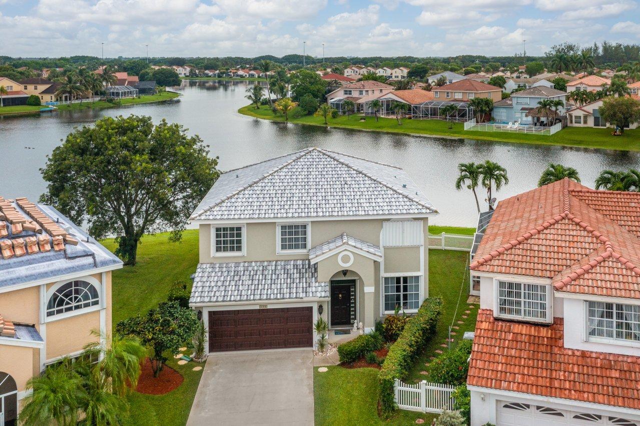 an aerial view of a house with a lake view