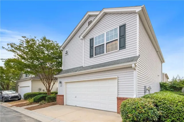 a front view of a house with a garage