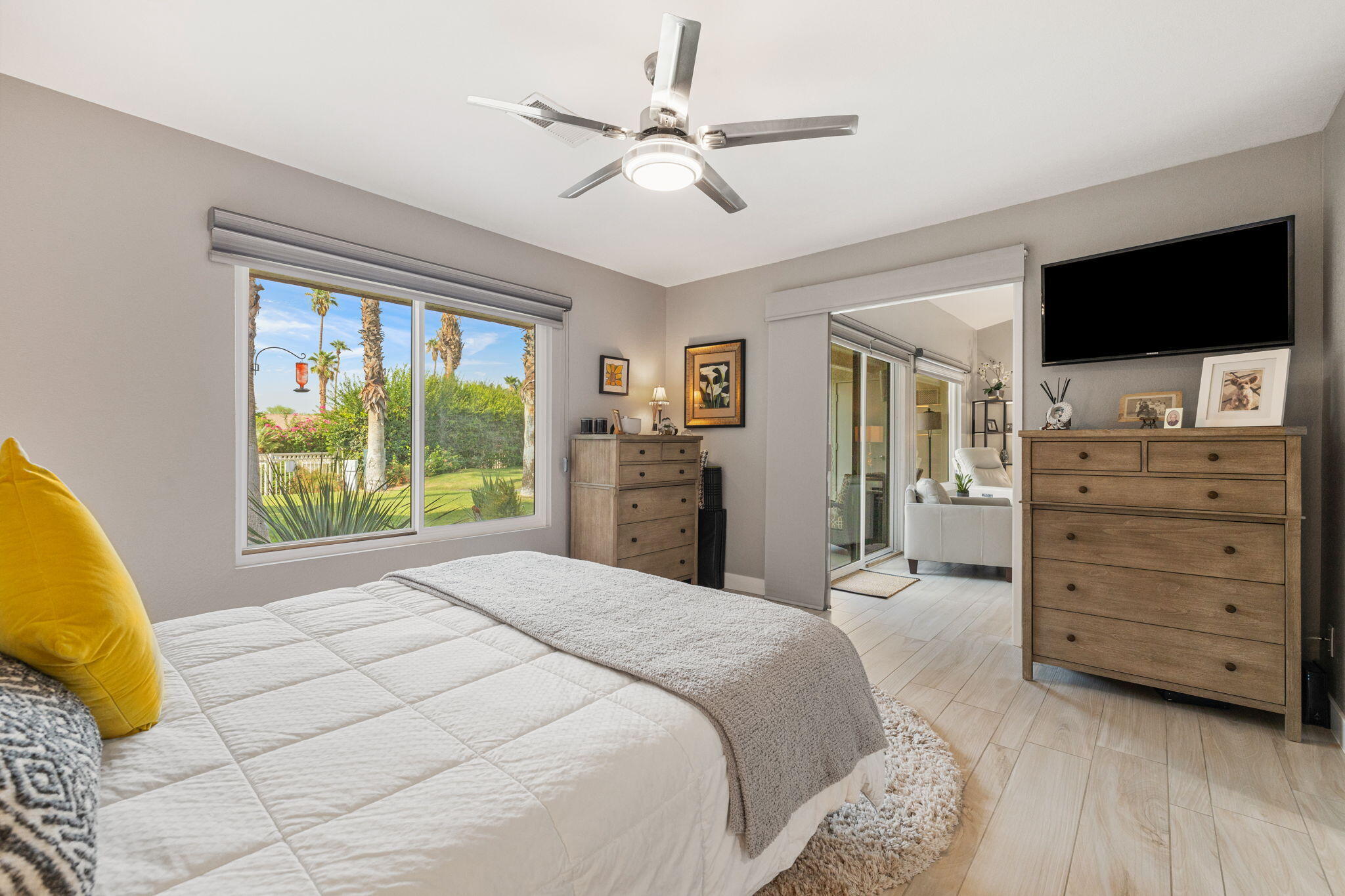 42831 Scirocco Road Palm Desert, CA 92211 - Photo 12 of 32 a spacious bedroom with a bed and a flat screen tv