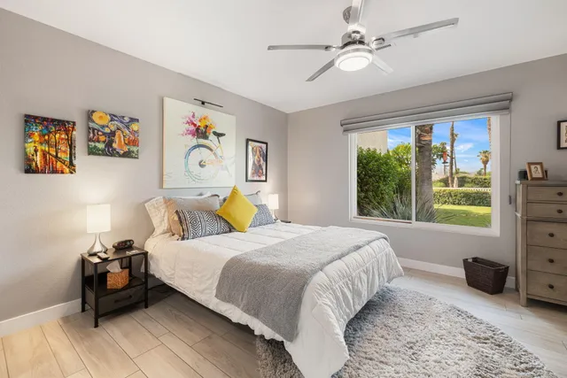 a bedroom with a bed furniture and a window