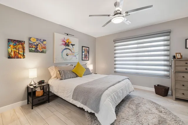 a bedroom with a bed and a view of bedroom