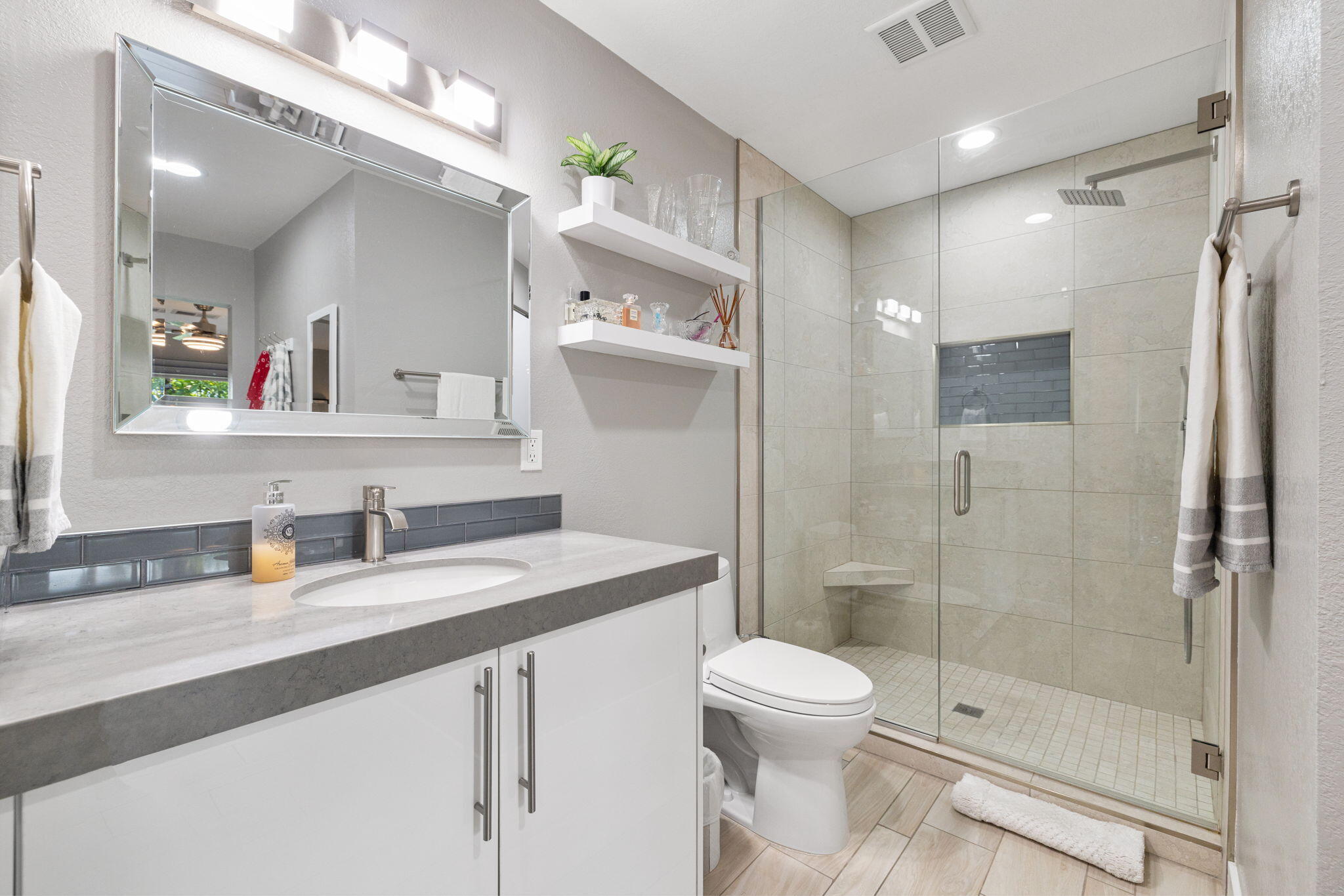 42831 Scirocco Road Palm Desert, CA 92211 - Photo 16 of 32 a bathroom with a sink a toilet and shower