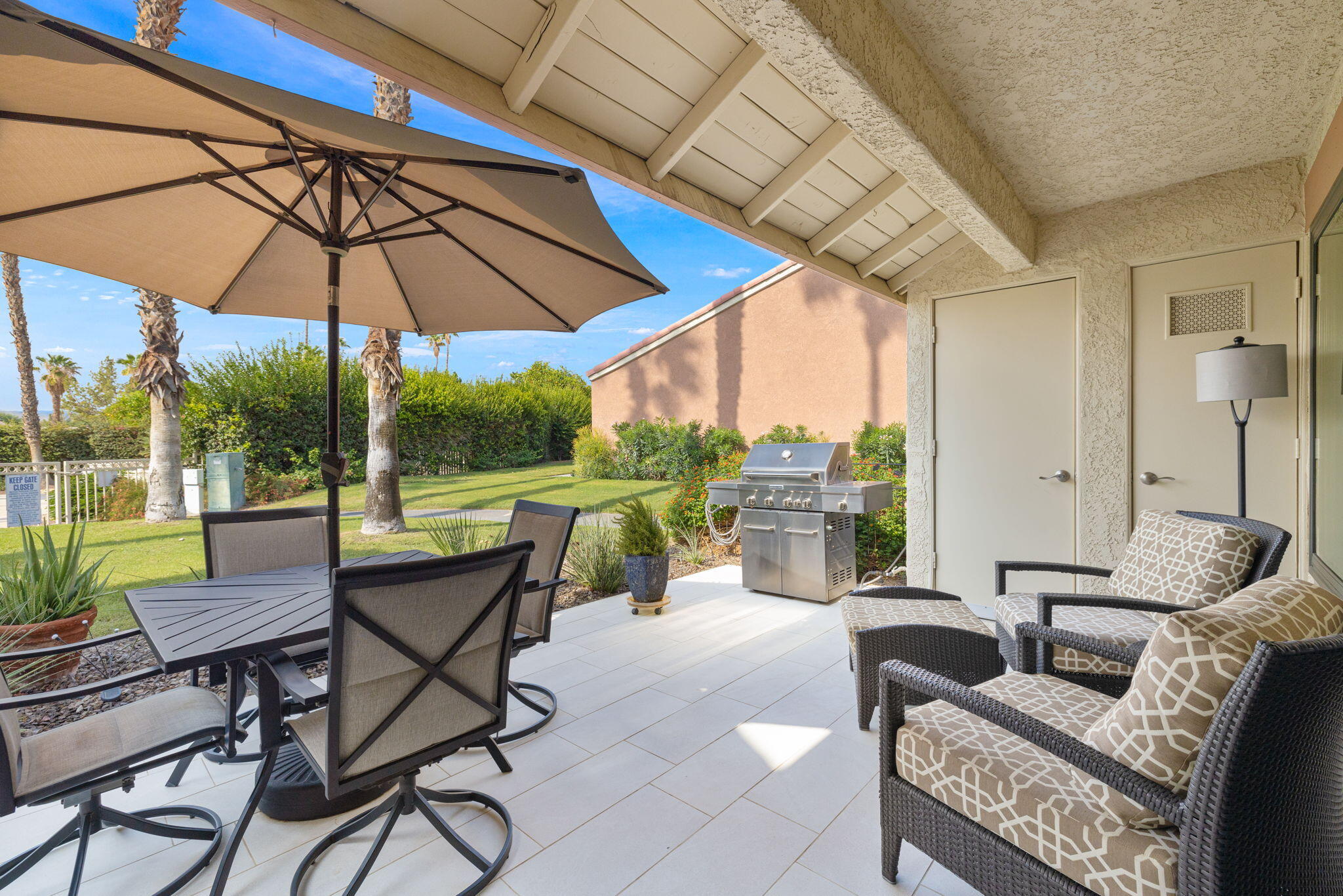 42831 Scirocco Road Palm Desert, CA 92211 - Photo 17 of 32 a view of an outdoor sitting area with furniture and backyard