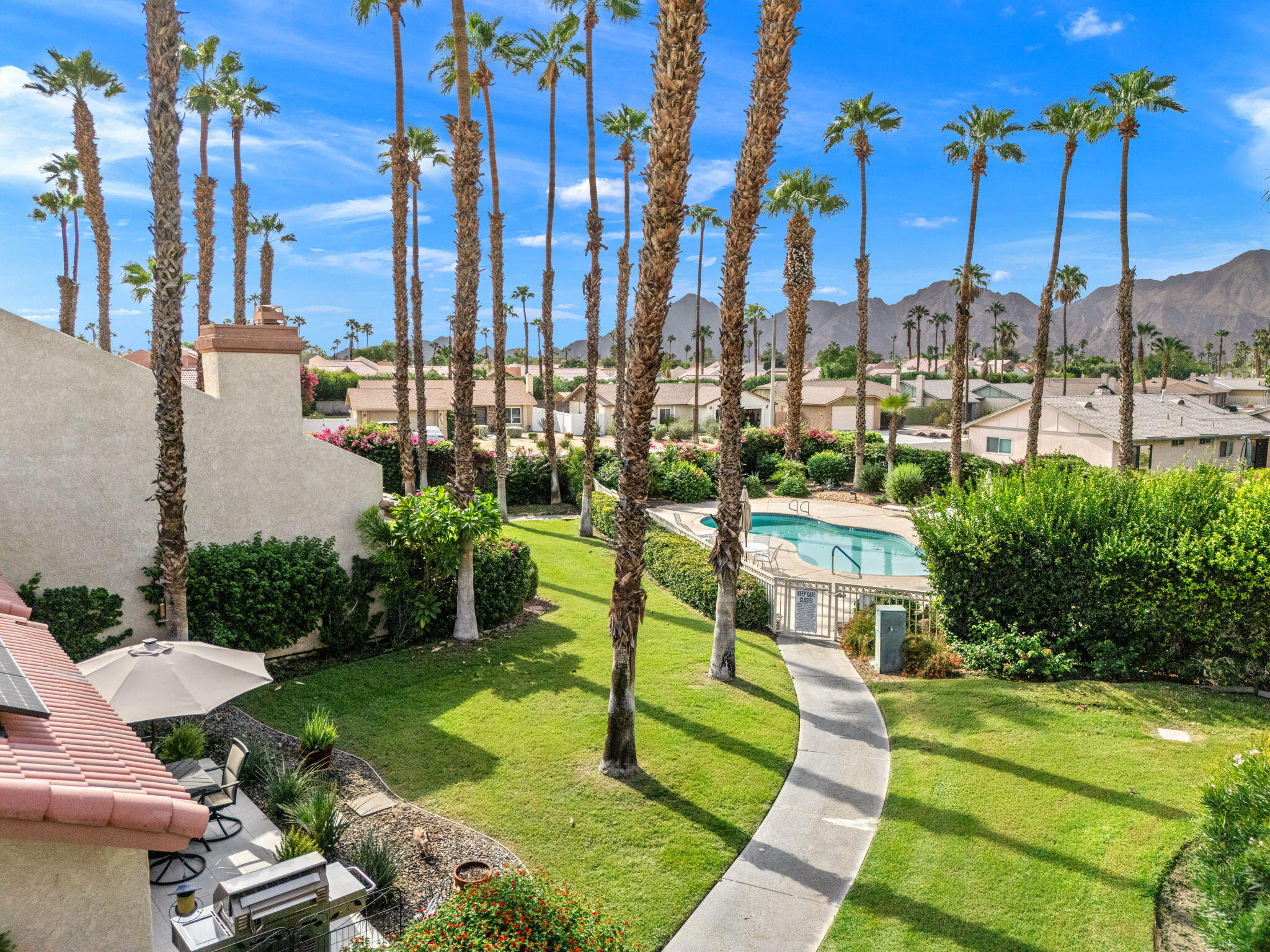 42831 Scirocco Road Palm Desert, CA 92211 - Photo 22 of 32 a view of a city with tall buildings