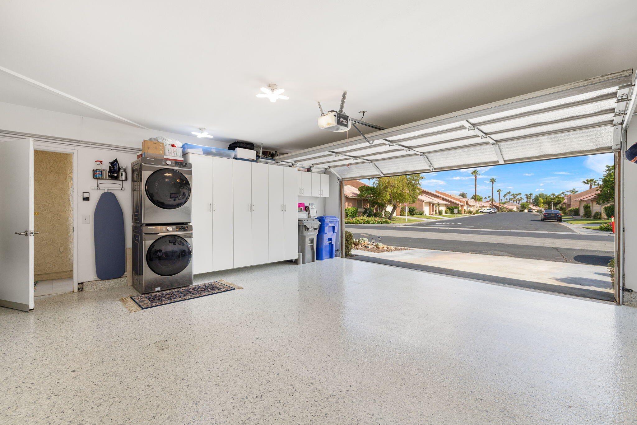 42831 Scirocco Road Palm Desert, CA 92211 - Photo 25 of 32 a view of a storage and utility room with washer and dryer