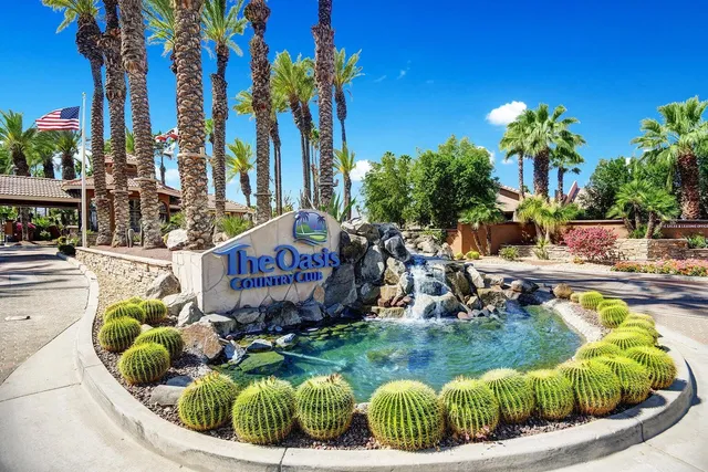 a view of a house with swimming pool and sitting area