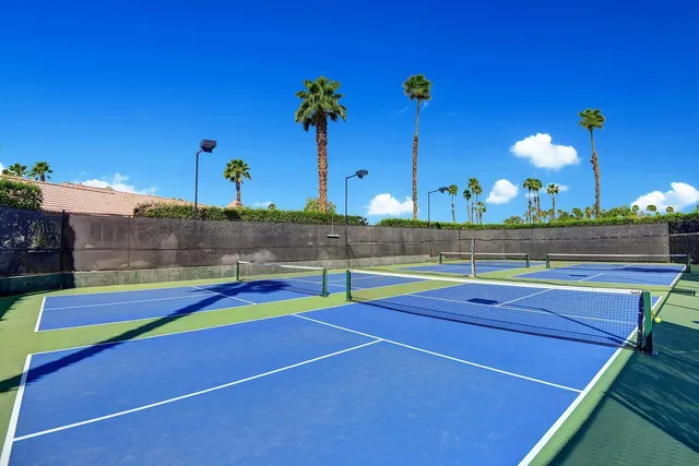 a view of an outdoor space and tennis court
