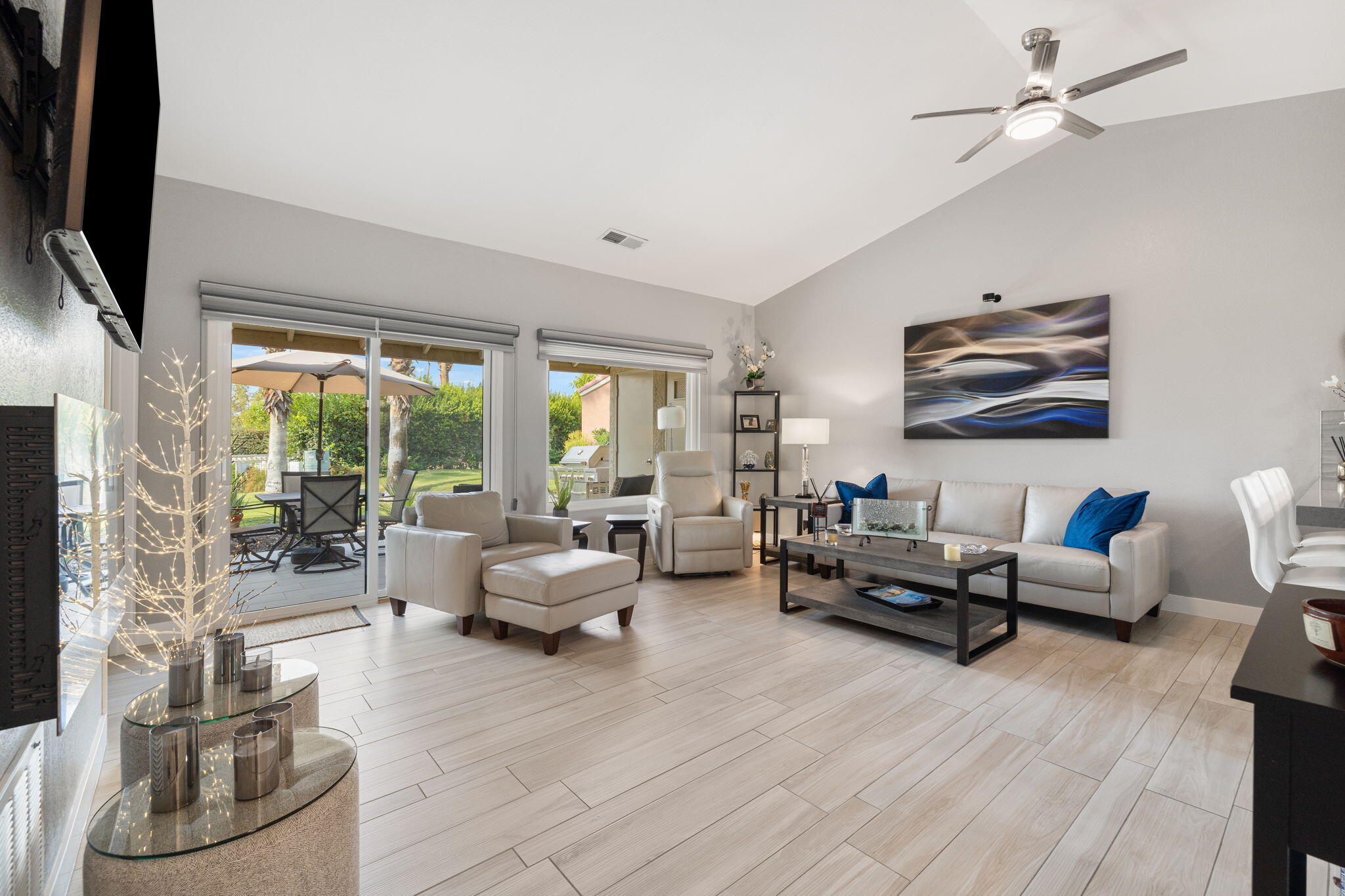 42831 Scirocco Road Palm Desert, CA 92211 - Photo 6 of 32 a living room with furniture or couch and a flat screen tv