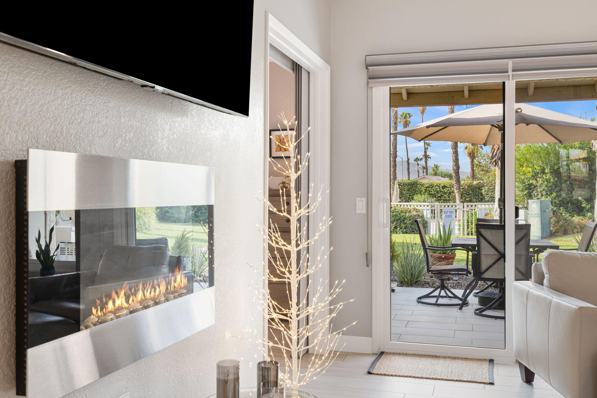 42831 Scirocco Road Palm Desert, CA 92211 - Photo 8 of 32 a living room with furniture and a window