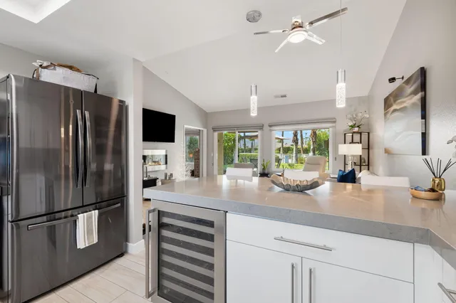 a kitchen with refrigerator and furniture