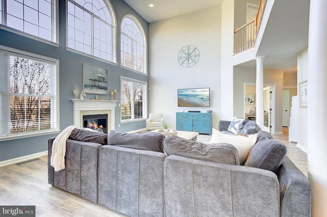 a kitchen with a dining table chairs sink and white appliances