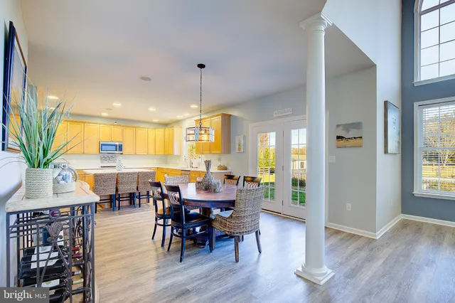 a kitchen with a sink a counter top space cabinets and stainless steel appliances