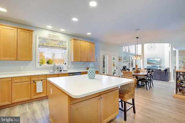 a view of staircase with railing and white walls