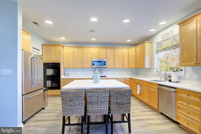 a view of a bedroom with wooden floor