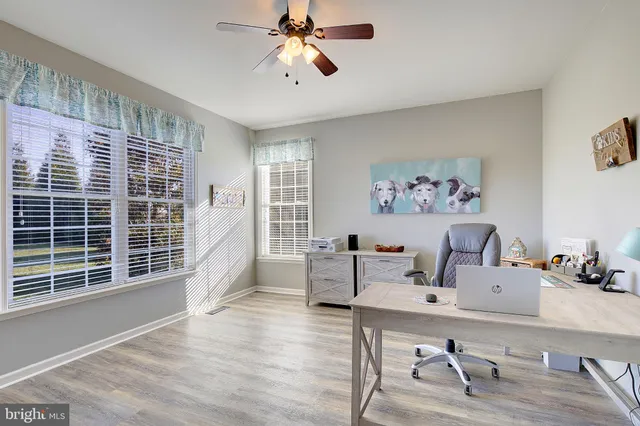 a bathroom with a sink vanity tub and shower