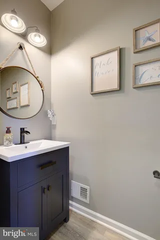 a large spacious bathroom with a granite countertop tub sink and mirror