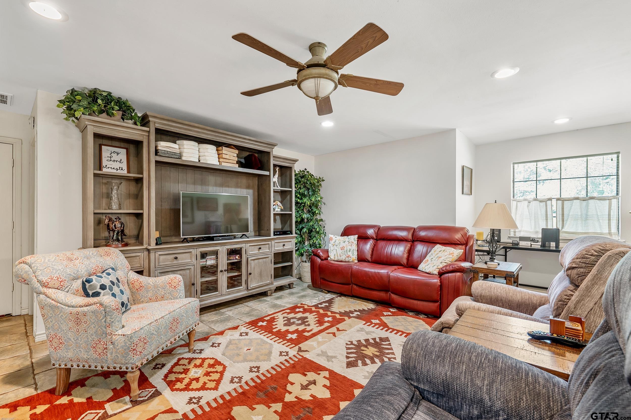 18054 Silver Leaf Flint, TX 75762 - Photo 11 of 30 a living room with furniture and a flat screen tv