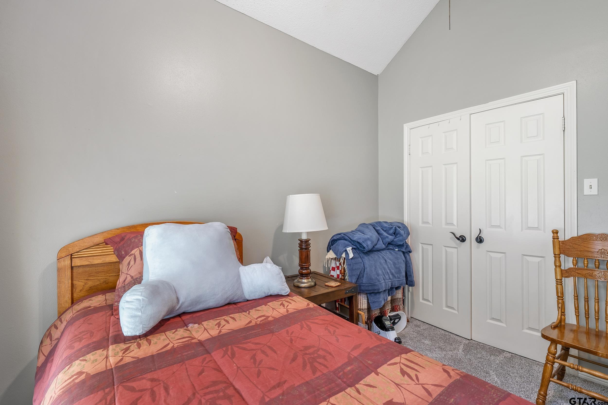 18054 Silver Leaf Flint, TX 75762 - Photo 20 of 30 a bedroom with a bed and chair