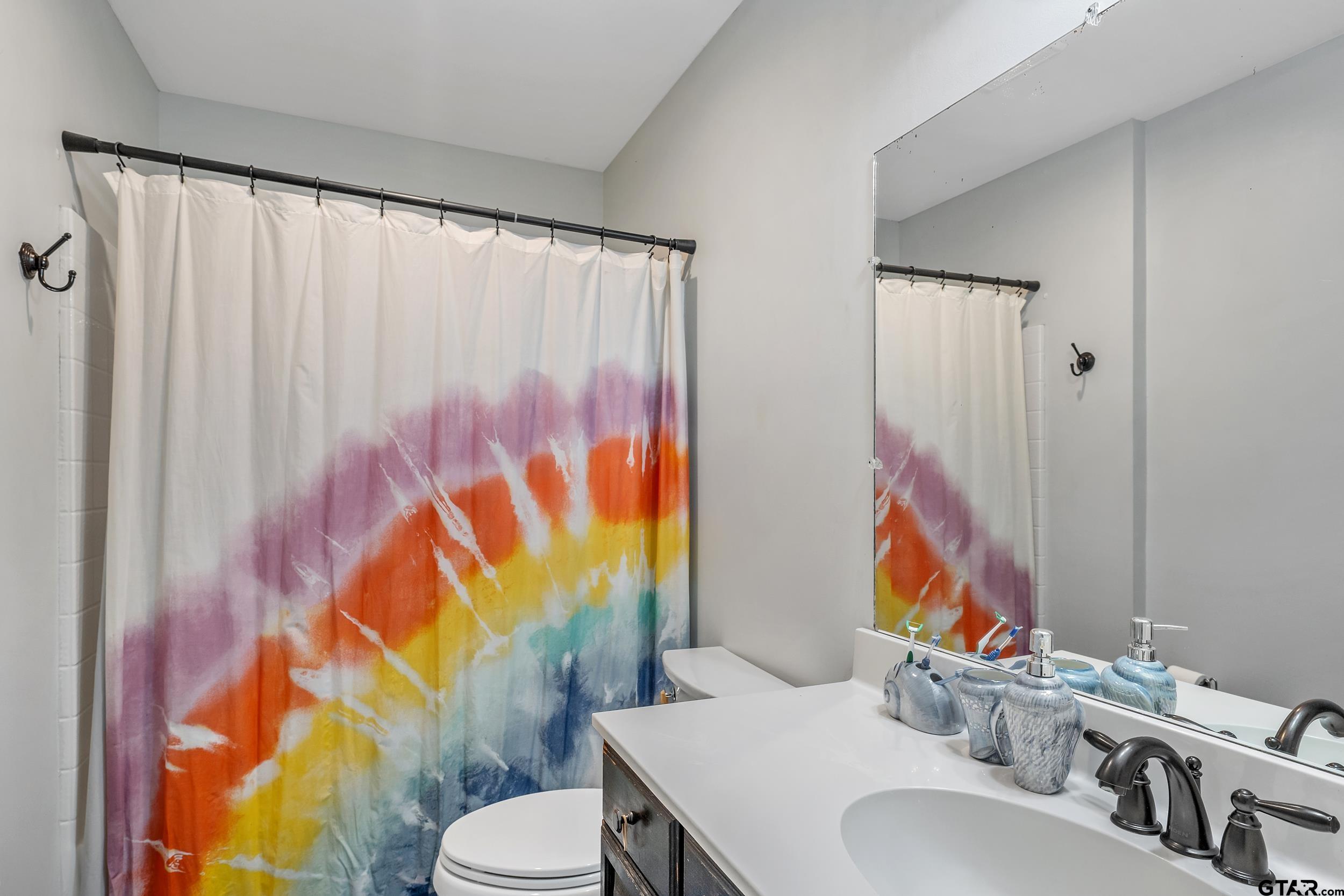 18054 Silver Leaf Flint, TX 75762 - Photo 22 of 30 a bathroom with a sink toilet and shower