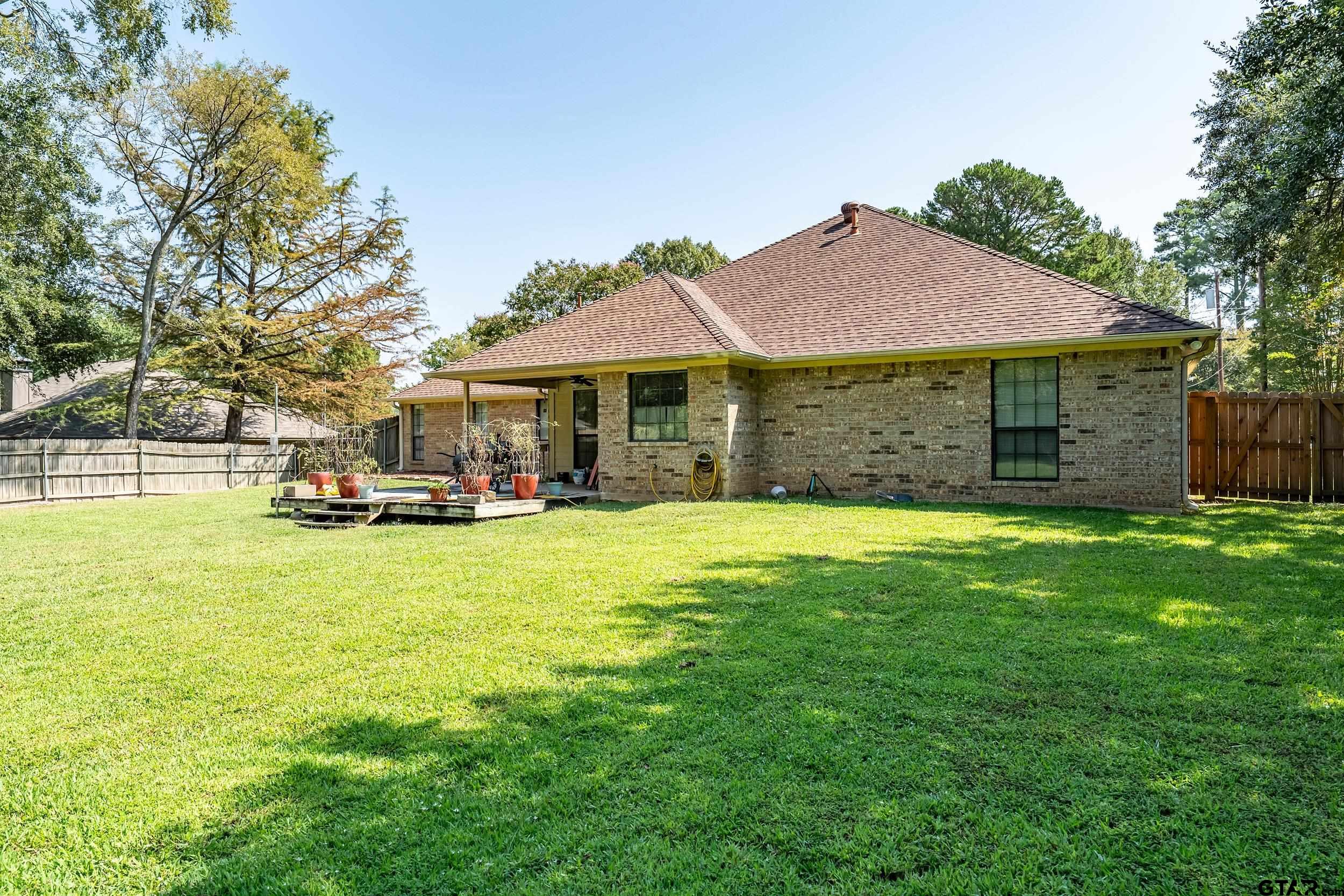 18054 Silver Leaf Flint, TX 75762 - Photo 27 of 30 a front view of a house with a garden