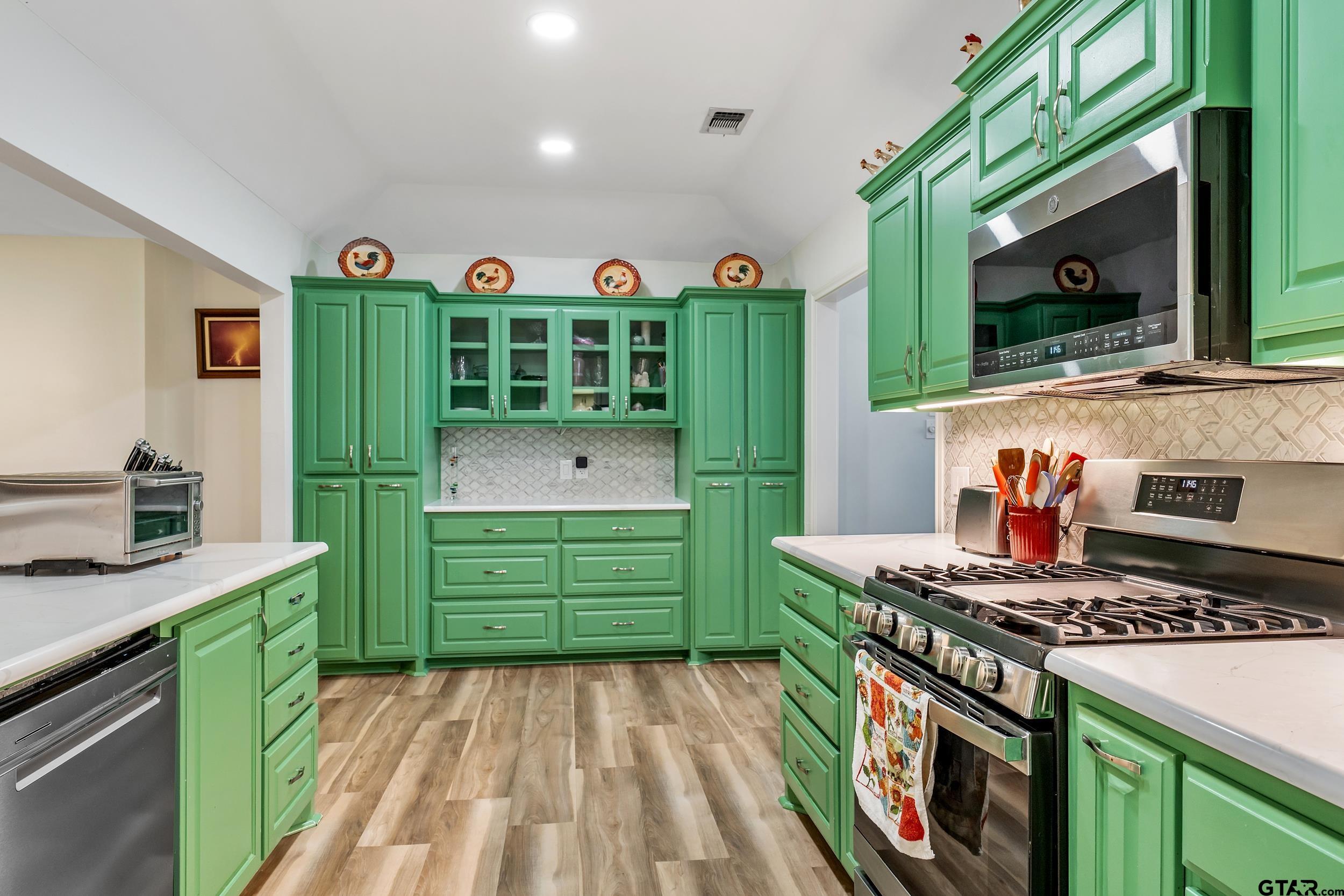 18054 Silver Leaf Flint, TX 75762 - Photo 9 of 30 a kitchen with a stove and a microwave
