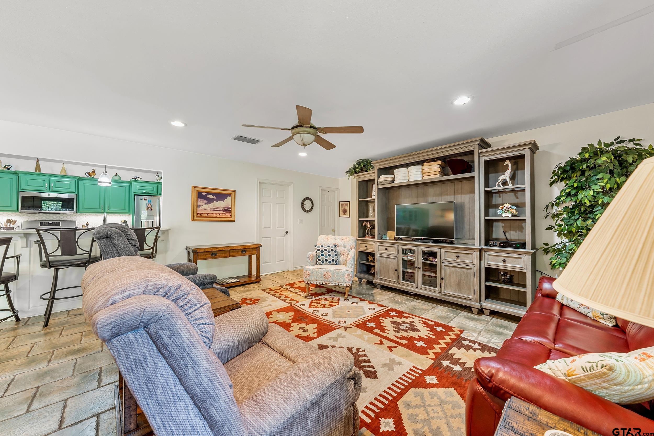 18054 Silver Leaf Flint, TX 75762 - Photo 10 of 30 a living room with furniture and a flat screen tv