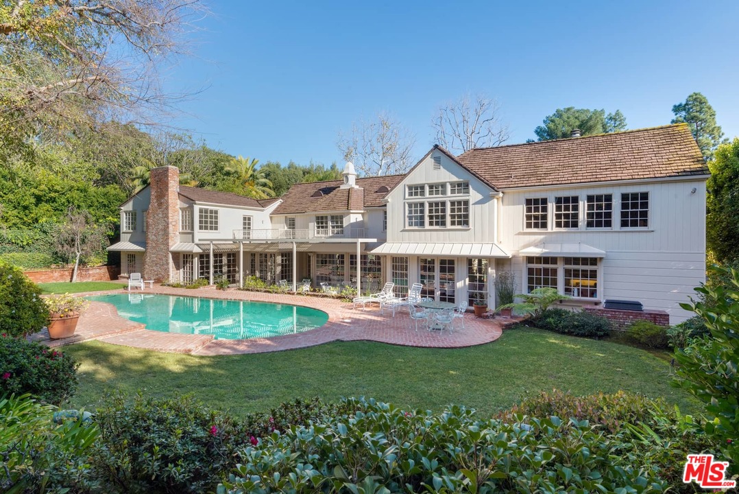 1027 Summit Drive Beverly Hills, CA 90210 - Photo 2 of 23 front view of a house with a yard