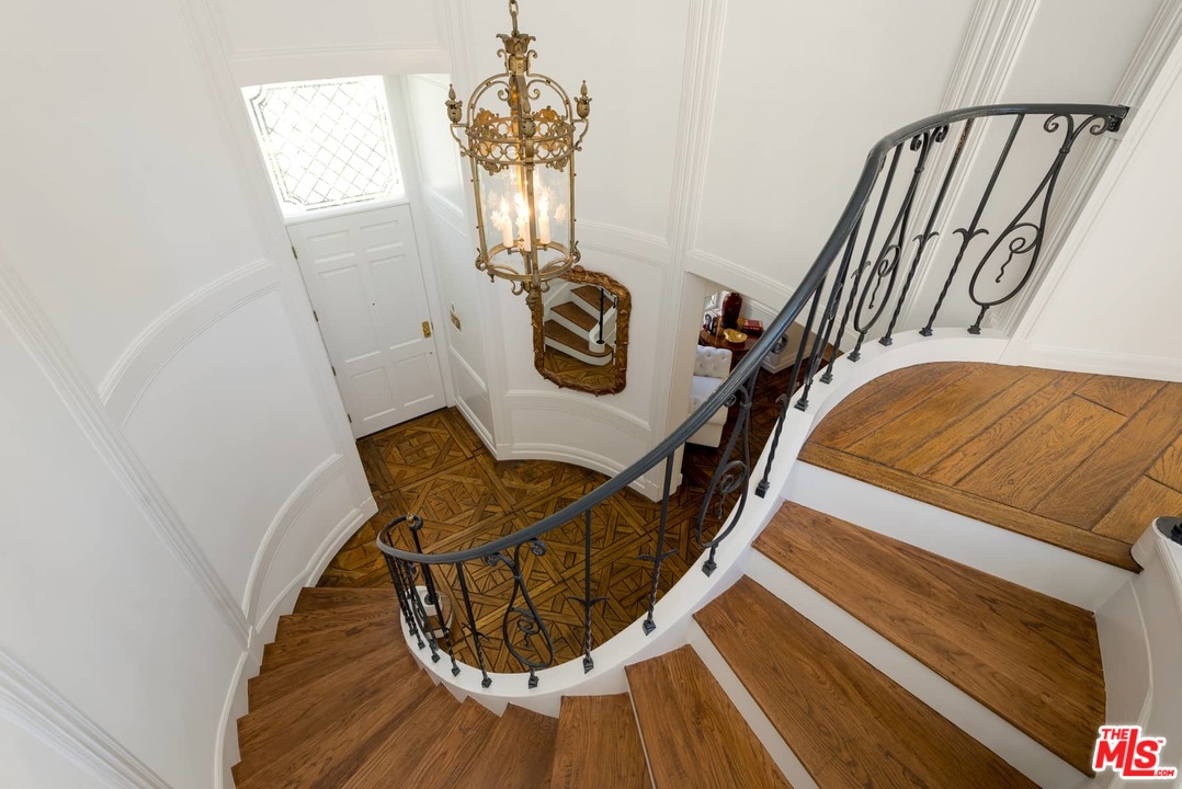 1027 Summit Drive Beverly Hills, CA 90210 - Photo 21 of 23 a view of entryway and hall with wooden floor