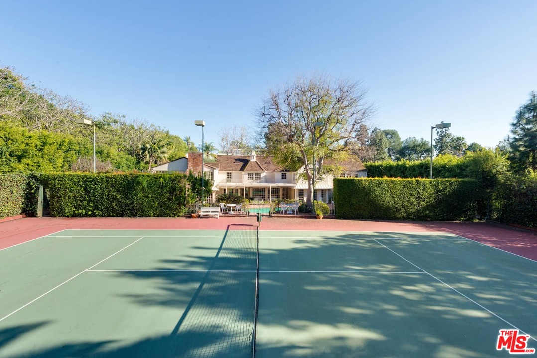 1027 Summit Drive Beverly Hills, CA 90210 - Photo 4 of 23 a view of a tennis court