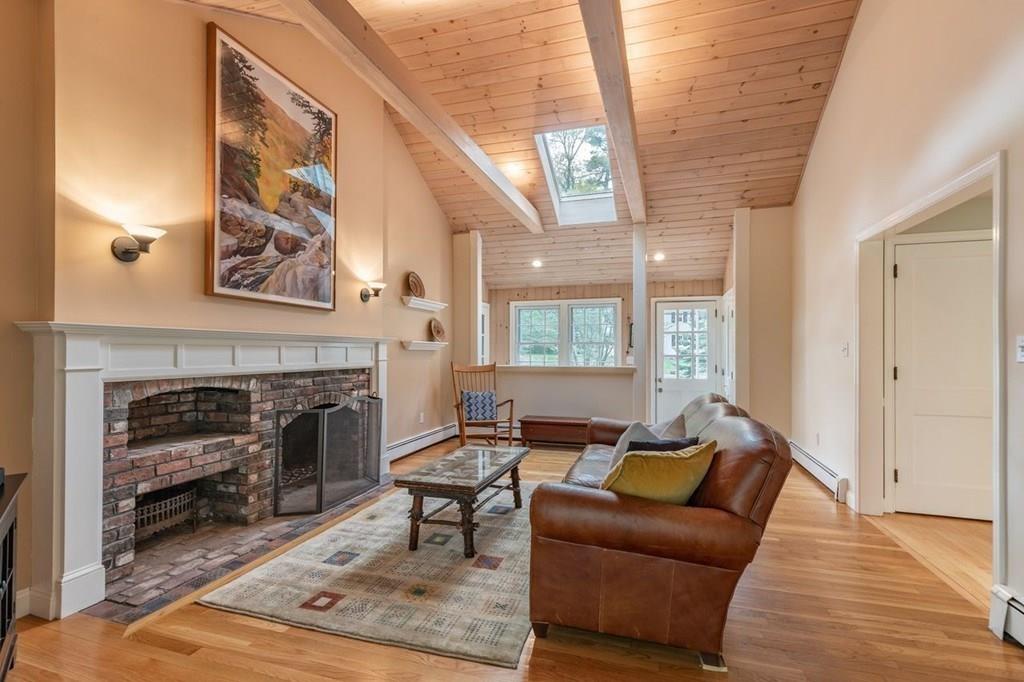 321 Hayward Mill Road Concord, MA 01742 - Photo 3 of 25 a living room with furniture and a fireplace
