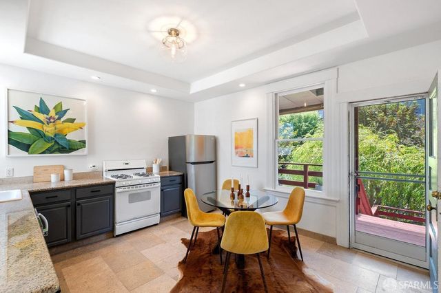 a view of a dining room with furniture window and outside view