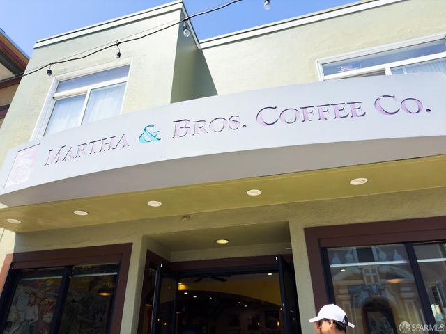 a view of a house with a tree