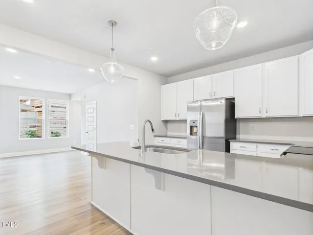 a view of a hallway with white walls