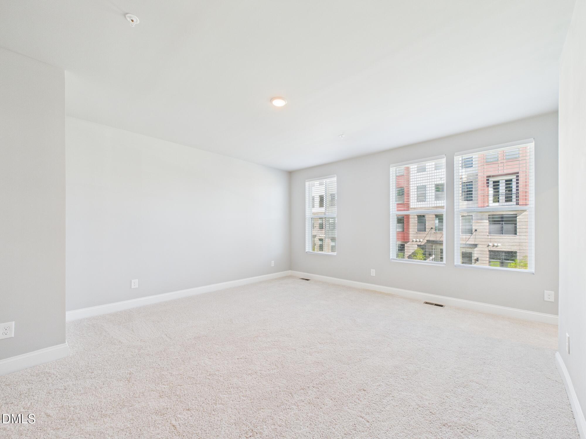 1251 Shaw View Alley, Unit 101 Raleigh, NC 27601 - Photo 19 of 47 an empty room with windows