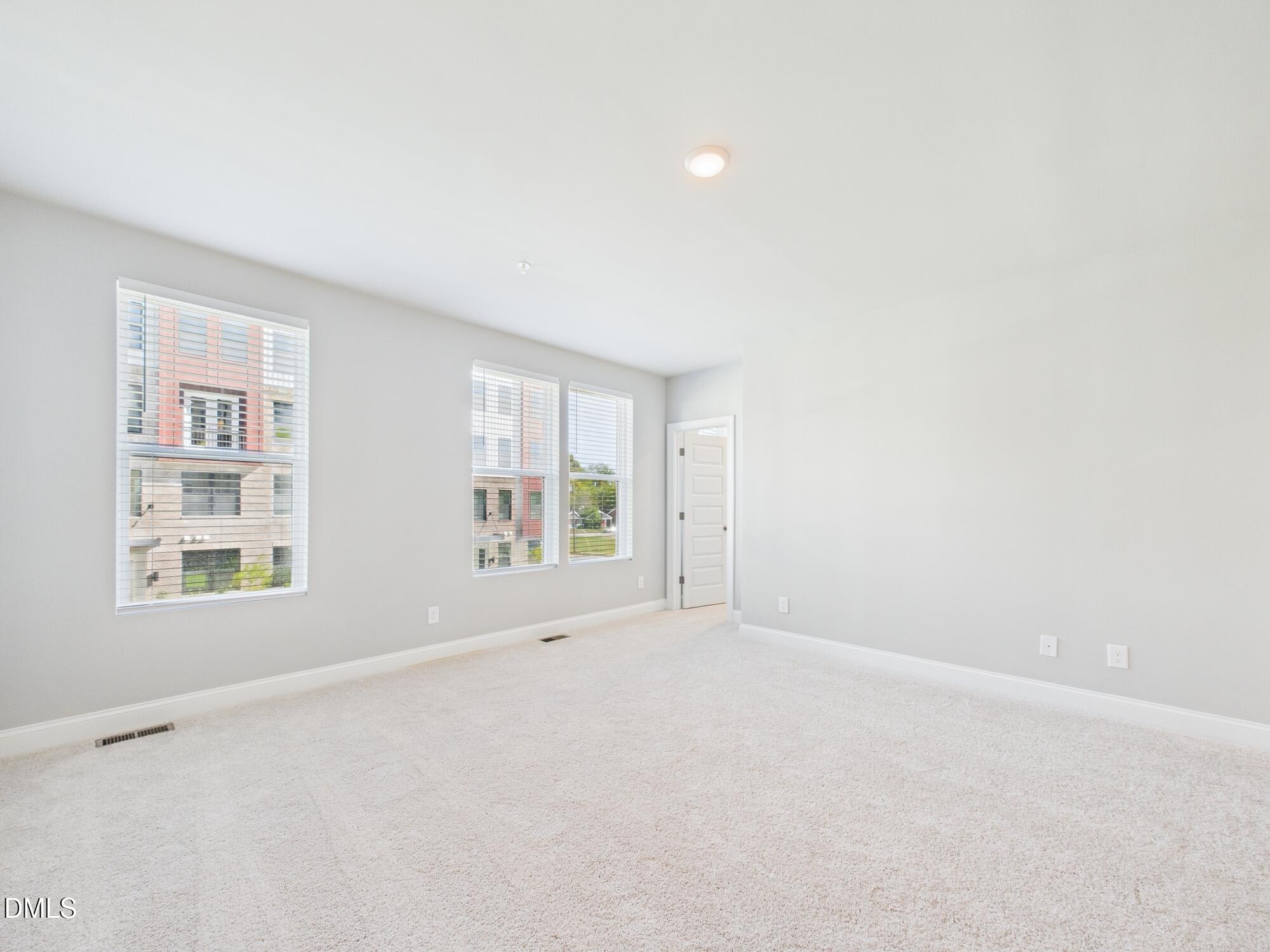 1251 Shaw View Alley, Unit 101 Raleigh, NC 27601 - Photo 22 of 47 an empty room with a window