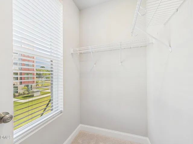 a bathroom with a granite countertop sink mirror and double