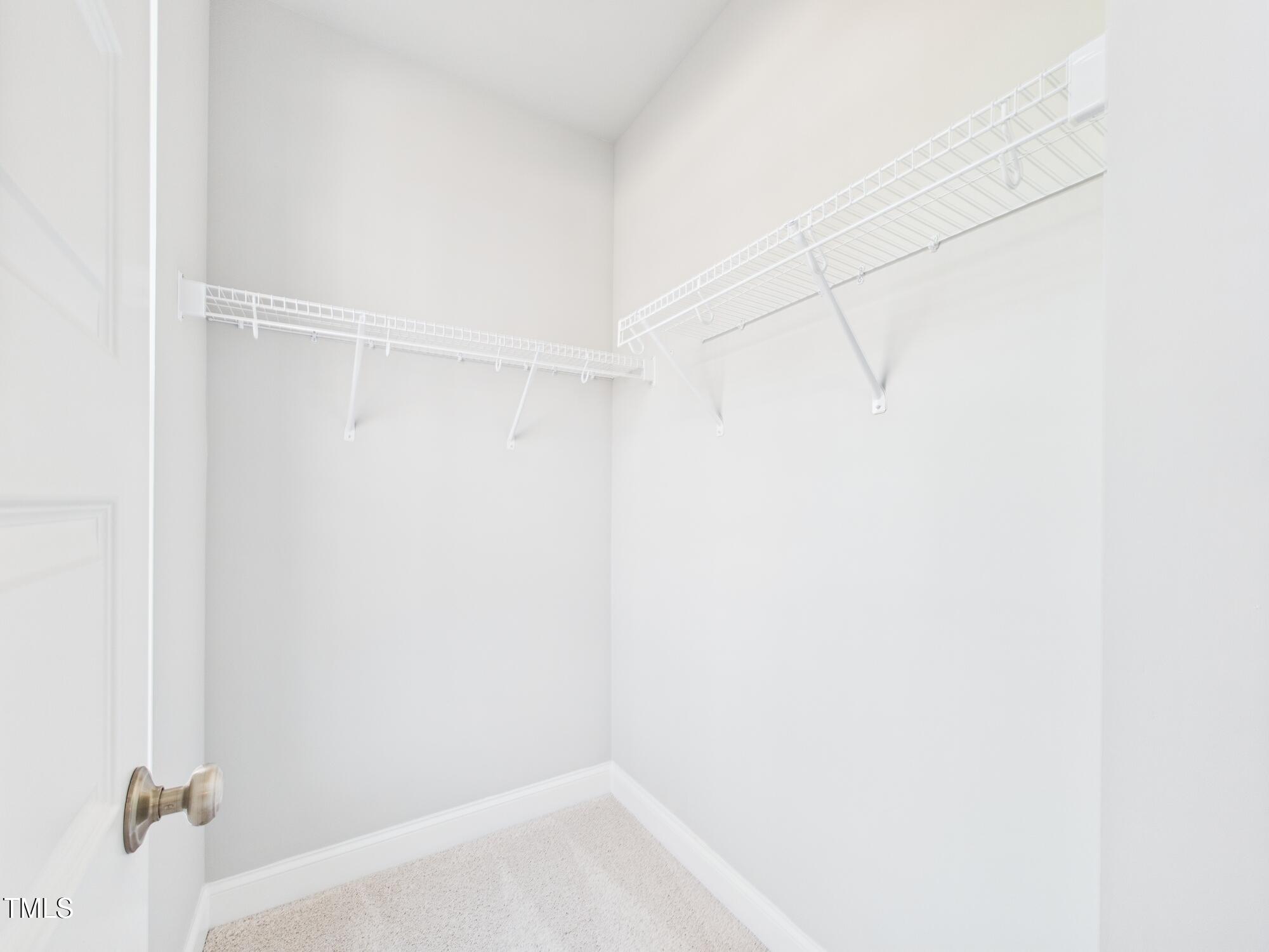 1251 Shaw View Alley, Unit 101 Raleigh, NC 27601 - Photo 24 of 47 a view of small space with racks on the wall