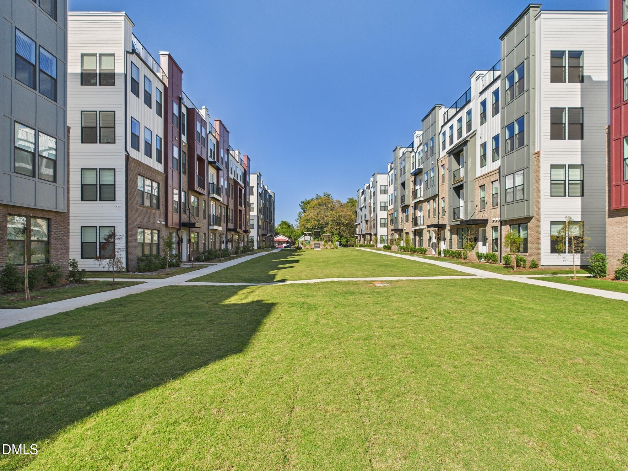 1251 Shaw View Alley, Unit 101 Raleigh, NC 27601 - Photo 3 of 47 a swimming pool with buildings in the background