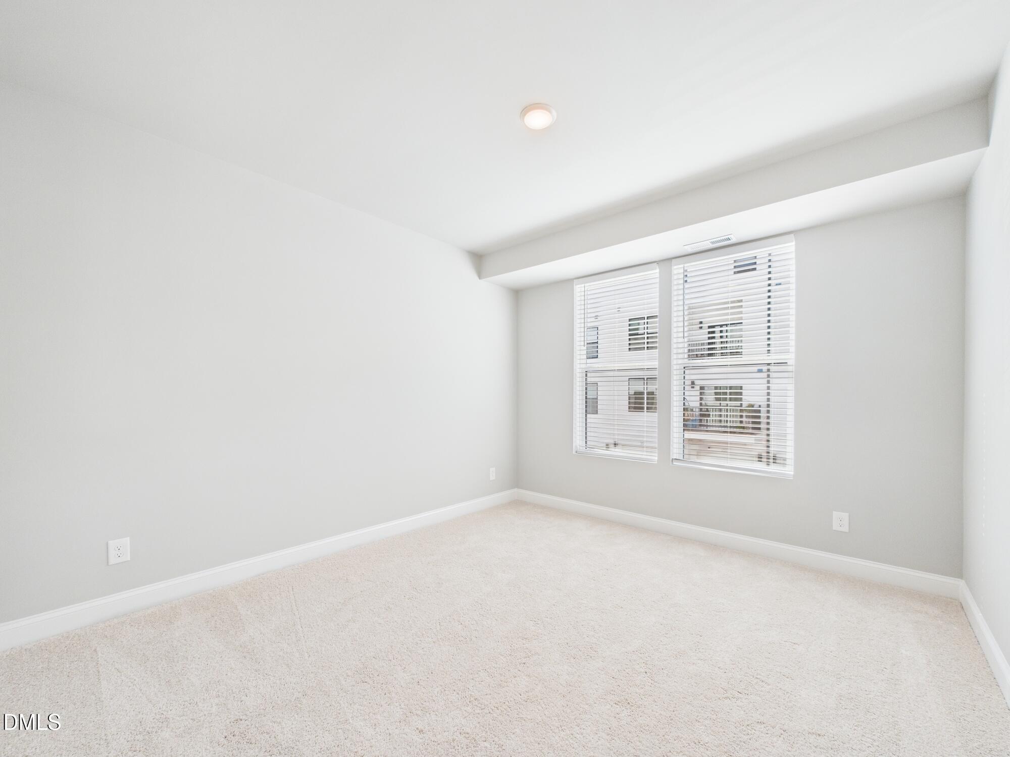 1251 Shaw View Alley, Unit 101 Raleigh, NC 27601 - Photo 34 of 47 an empty room with a window
