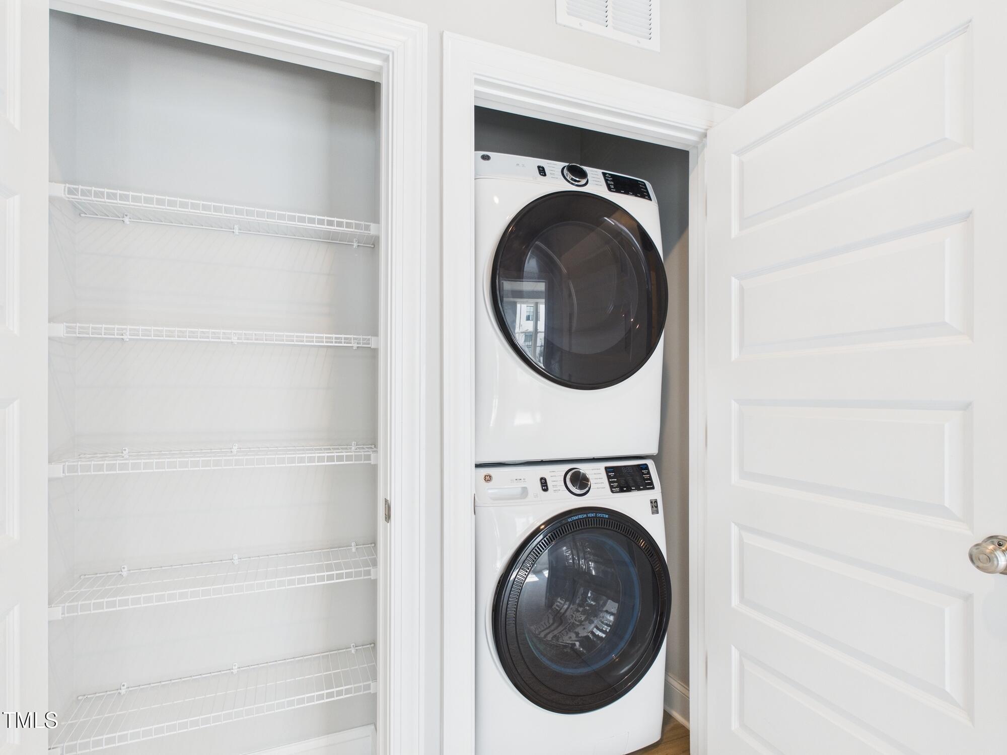 1251 Shaw View Alley, Unit 101 Raleigh, NC 27601 - Photo 38 of 47 a utility room with dryer and washer