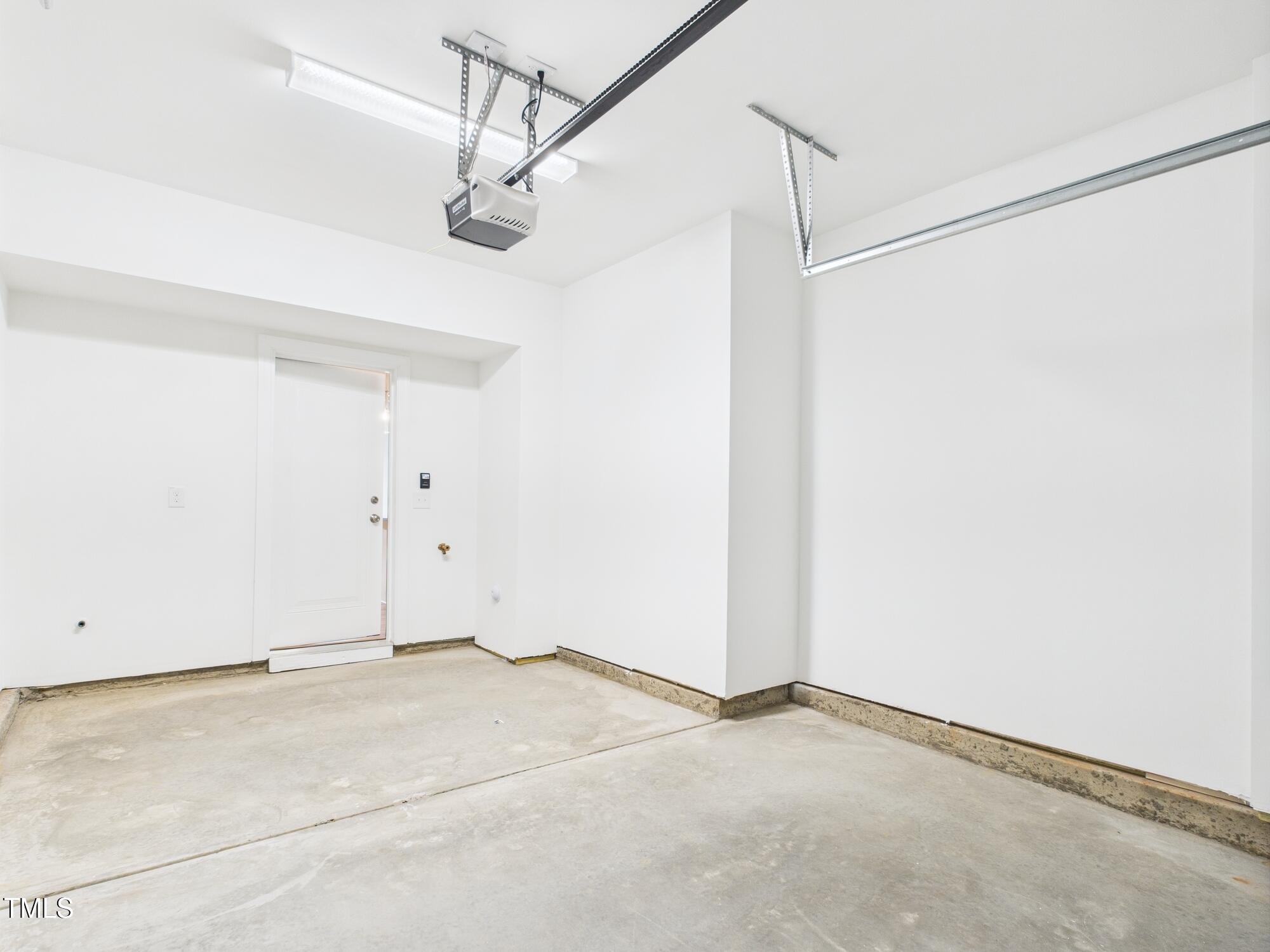 1251 Shaw View Alley, Unit 101 Raleigh, NC 27601 - Photo 42 of 47 a view of a room with drop ceiling fan