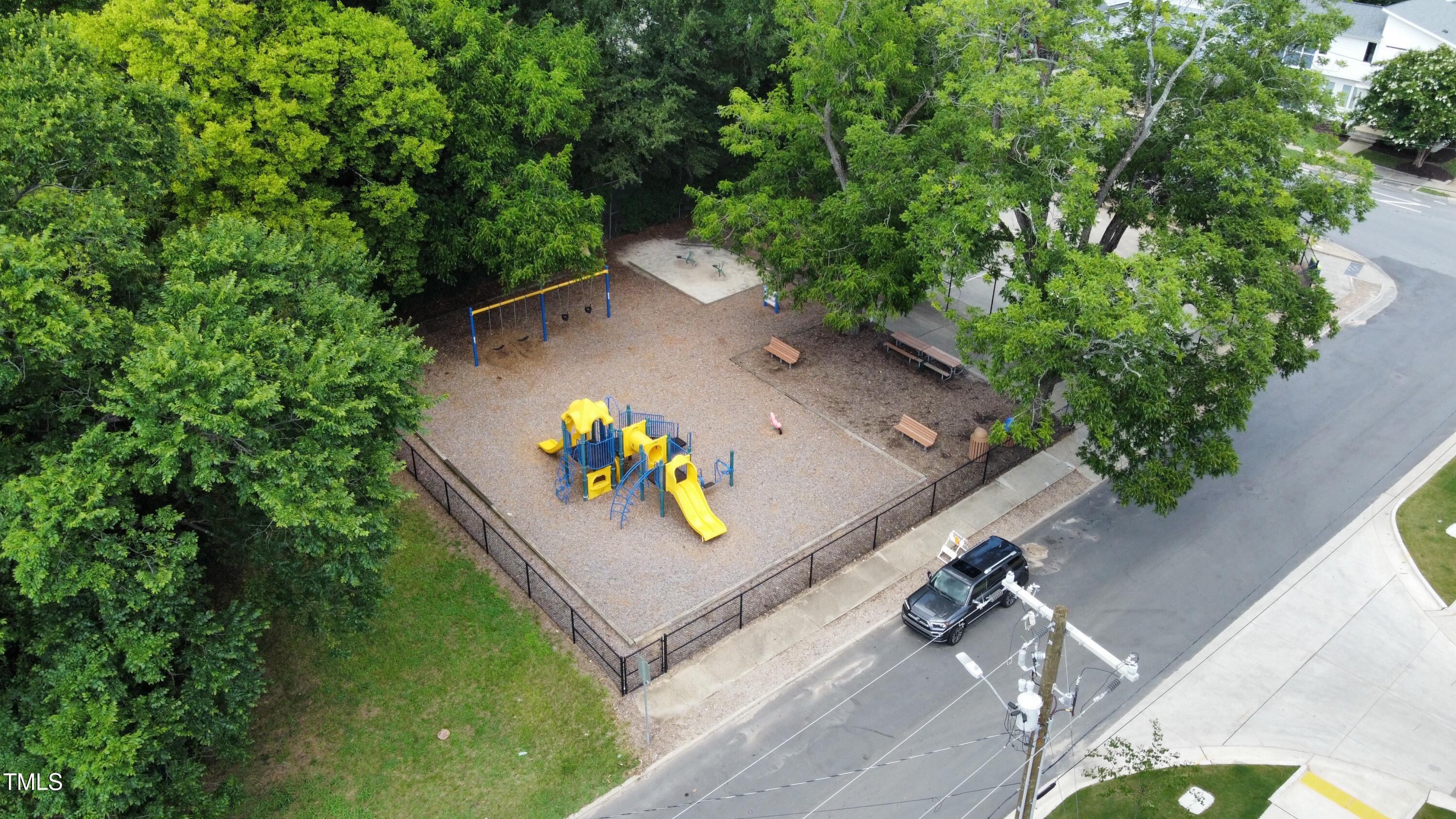 1251 Shaw View Alley, Unit 101 Raleigh, NC 27601 - Photo 46 of 47 an aerial view of a house with a yard