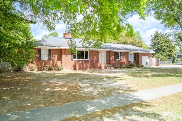 a front view of a house with swimming pool