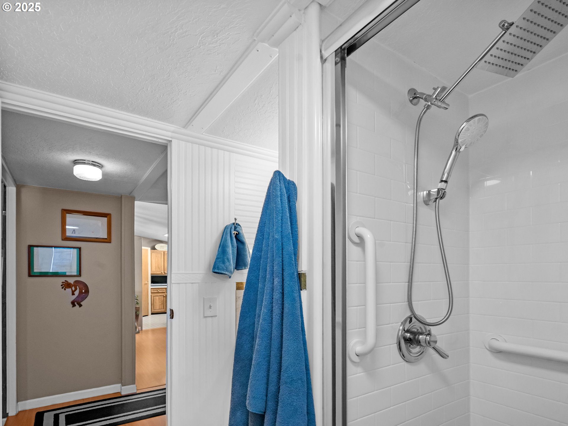 4355 Bren Loop Northeast Salem, OR 97305 - Photo 27 of 44 a bathroom with a glass shower door