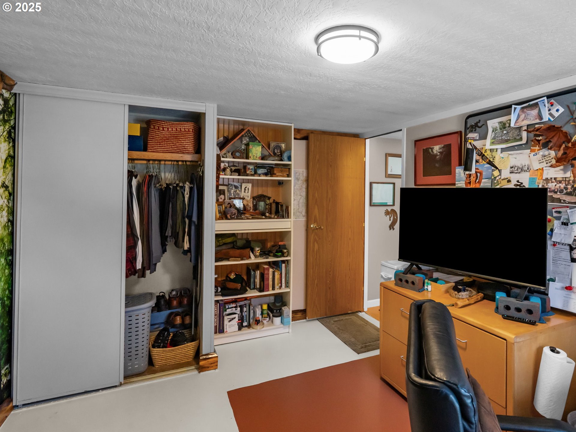 4355 Bren Loop Northeast Salem, OR 97305 - Photo 30 of 44 a view of a livingroom with furniture and a flat screen tv